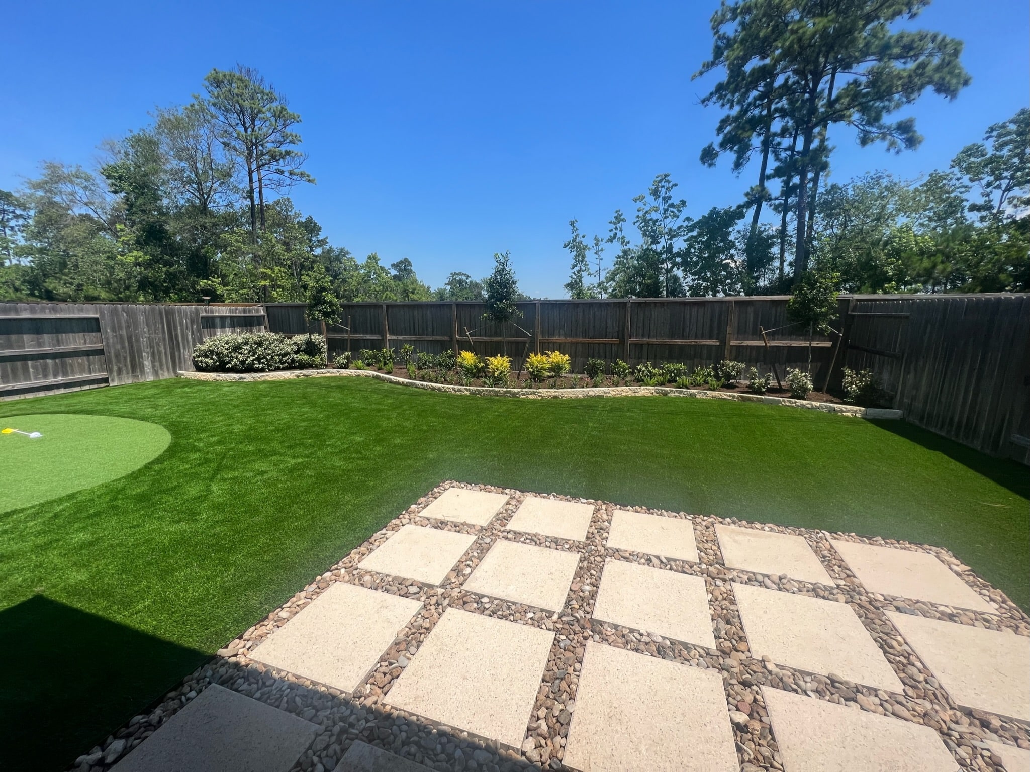freshly planted garden bed next to house